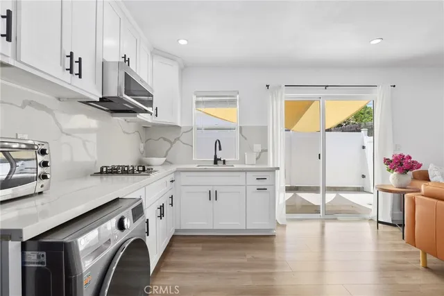 a bedroom with a bed and a night stand