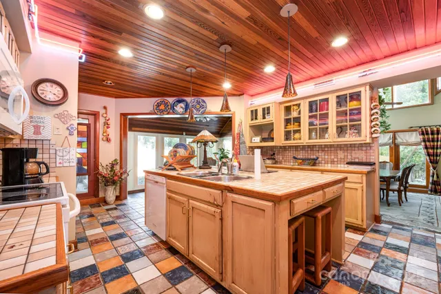 a kitchen that has a lot of cabinets in it