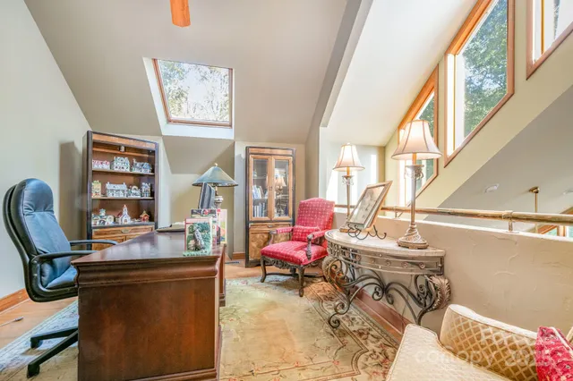 a view of a workspace with furniture and workspace