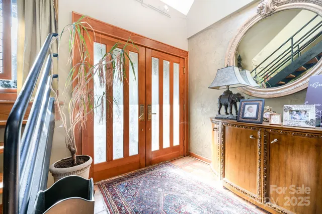 a view of an entryway with wooden floor