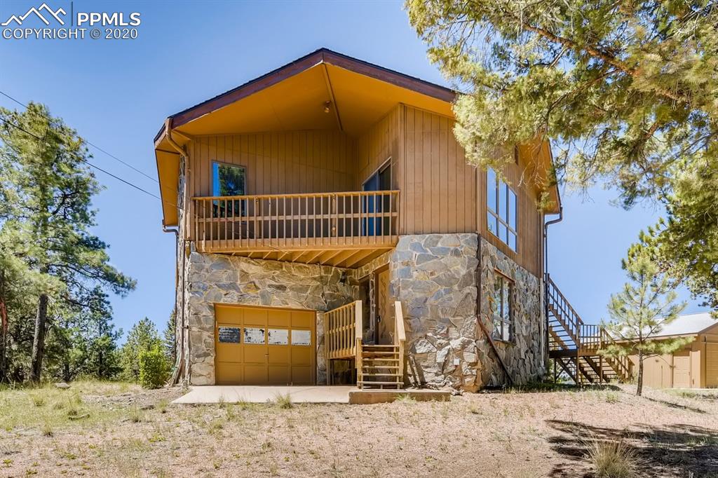 a view of a house with a fence