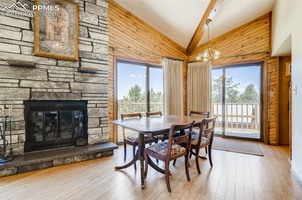 247 Pinewood Road Florissant, CO 80816 - Photo 15 of 39 a dining room with furniture window and wooden floor