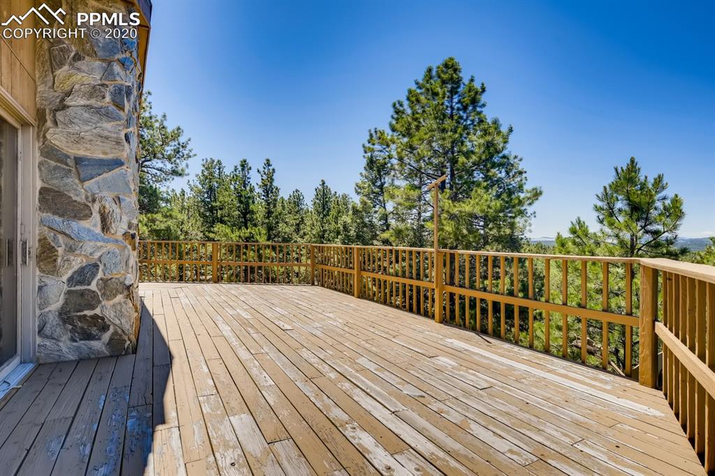 247 Pinewood Road Florissant, CO 80816 - Photo 21 of 39 a view of balcony with wooden floor and fence