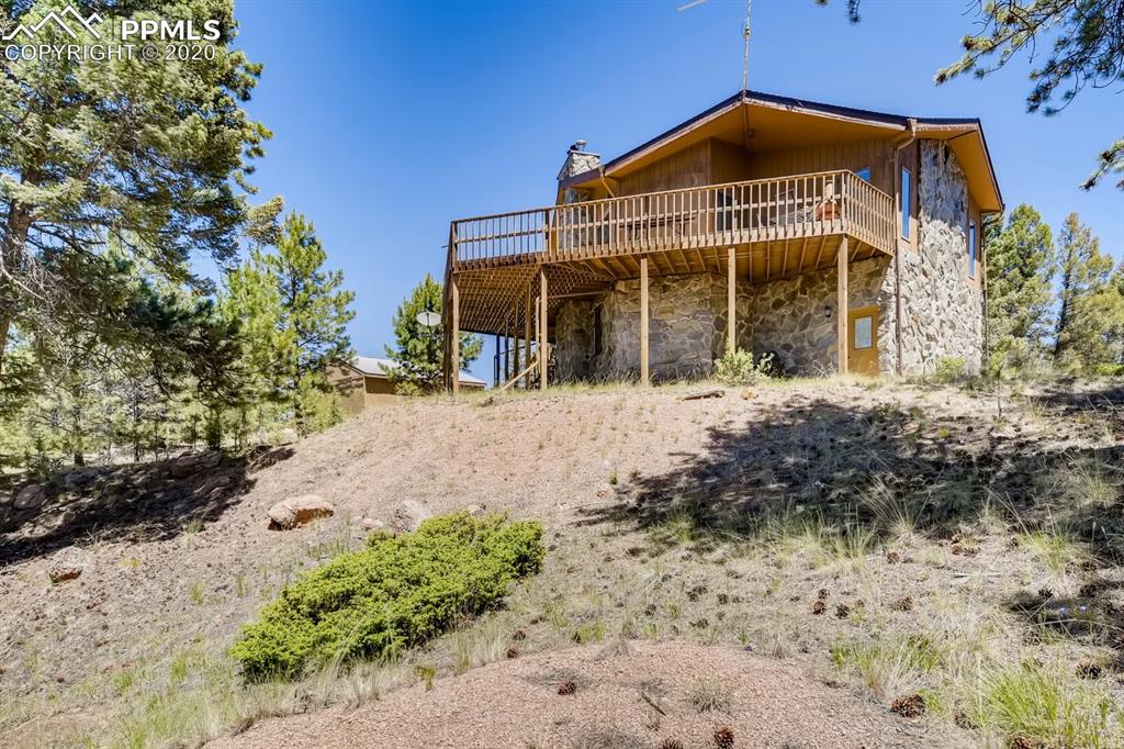 247 Pinewood Road Florissant, CO 80816 - Photo 23 of 39 a front view of a house with a yard