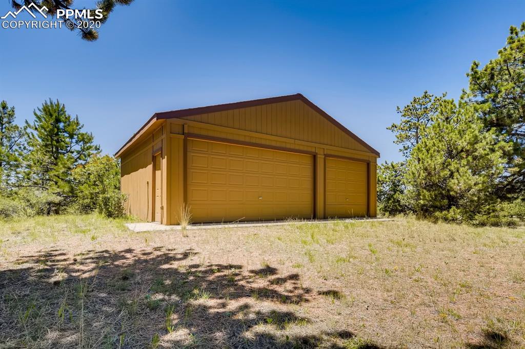 247 Pinewood Road Florissant, CO 80816 - Photo 24 of 39 a front view of a house with a yard