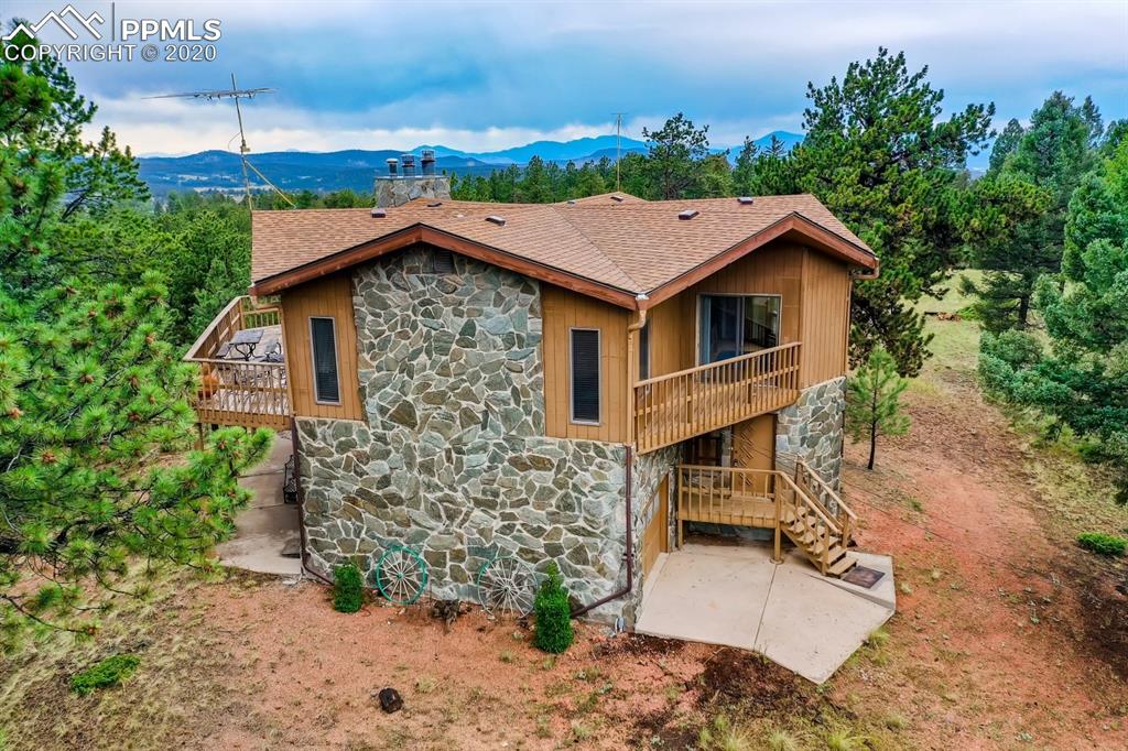 247 Pinewood Road Florissant, CO 80816 - Photo 30 of 39 a view of a house with a yard