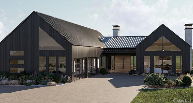 a view of a house and has windows and plants