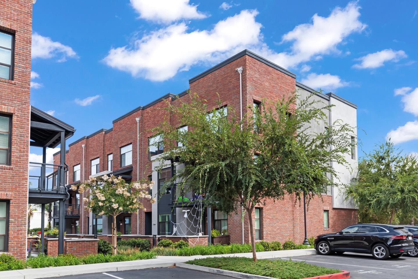 a view of a car parked in front of a building