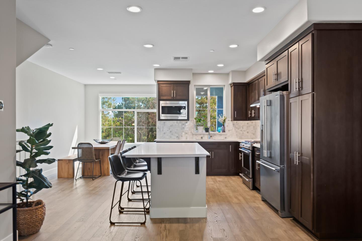 202 Malley Way Campbell, CA 95008 - Photo 12 of 29 a kitchen with kitchen island a large counter top space appliances and living room view