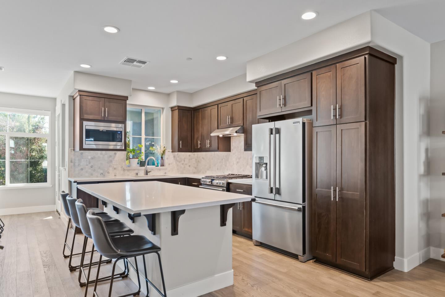 202 Malley Way Campbell, CA 95008 - Photo 13 of 29 a kitchen with stainless steel appliances granite countertop a refrigerator a stove a sink a dining table and chairs