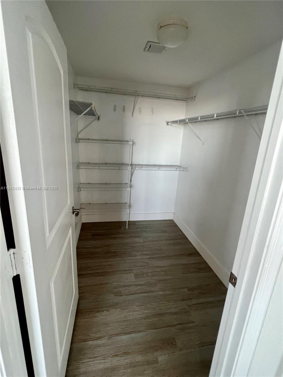 Kendall Miami, FL 33156 - Photo 14 of 22 a view of walk in closet with empty racks