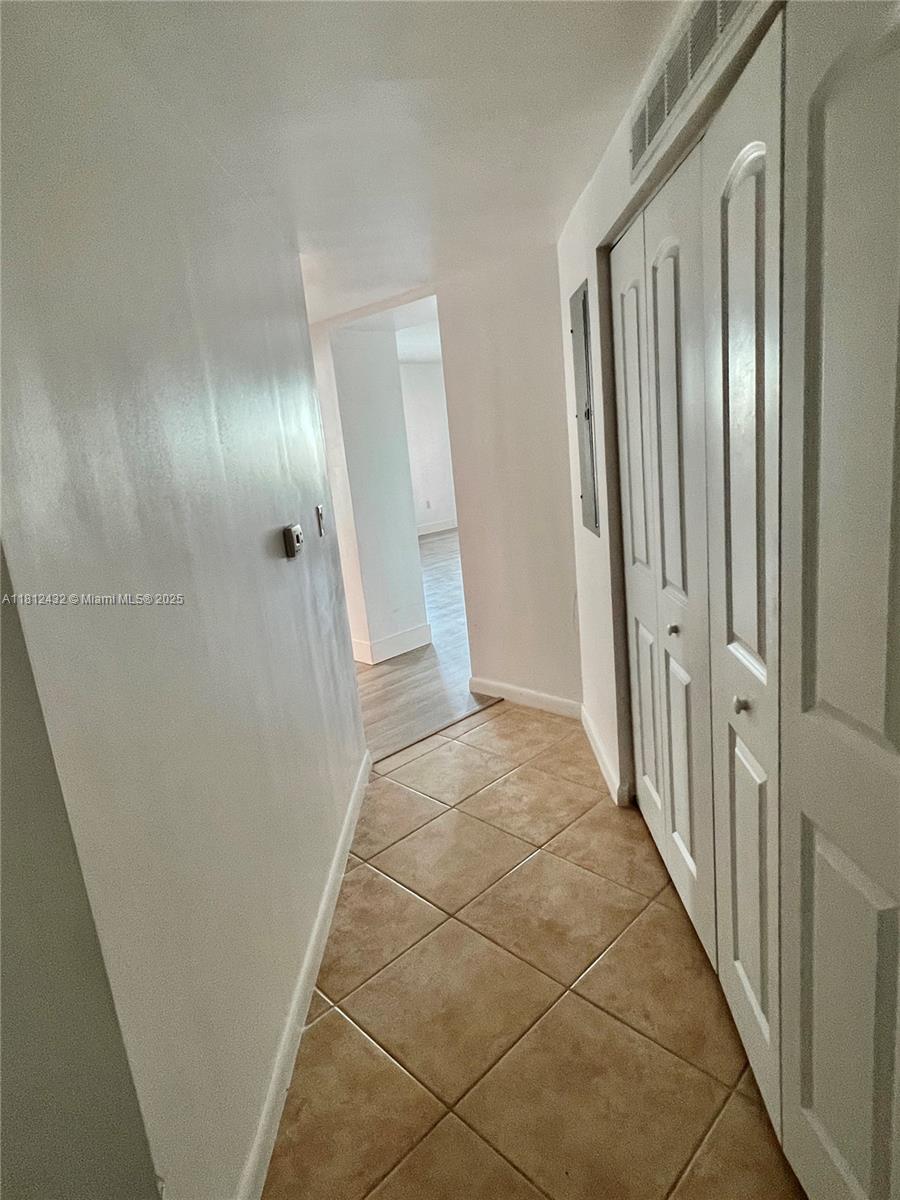 Kendall Miami, FL 33156 - Photo 6 of 22 a view of a hallway with wooden floor