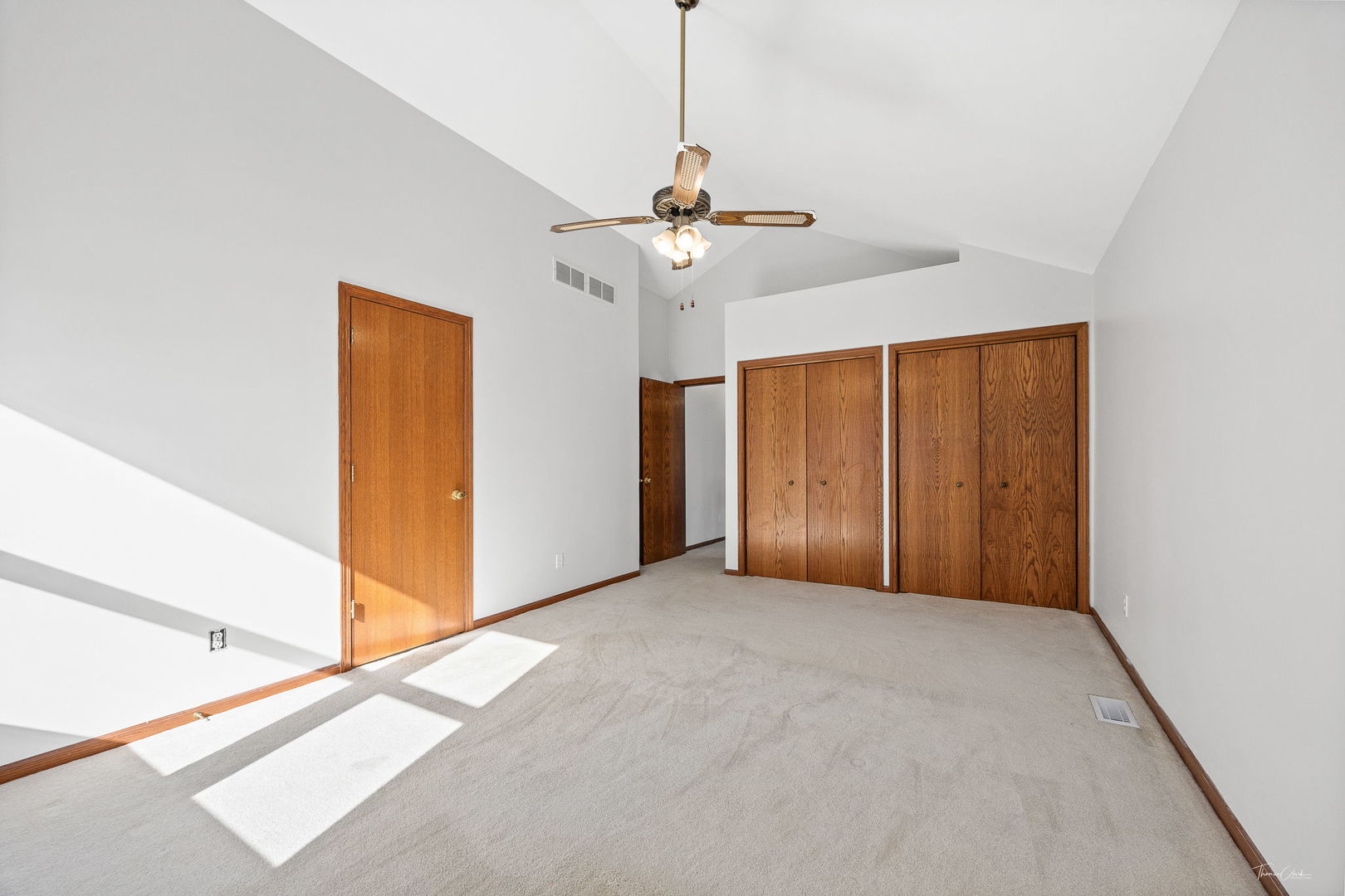 703 Avondale Lane Aurora, IL 60504 - Photo 19 of 40 a view of a room with a ceiling fan and a window