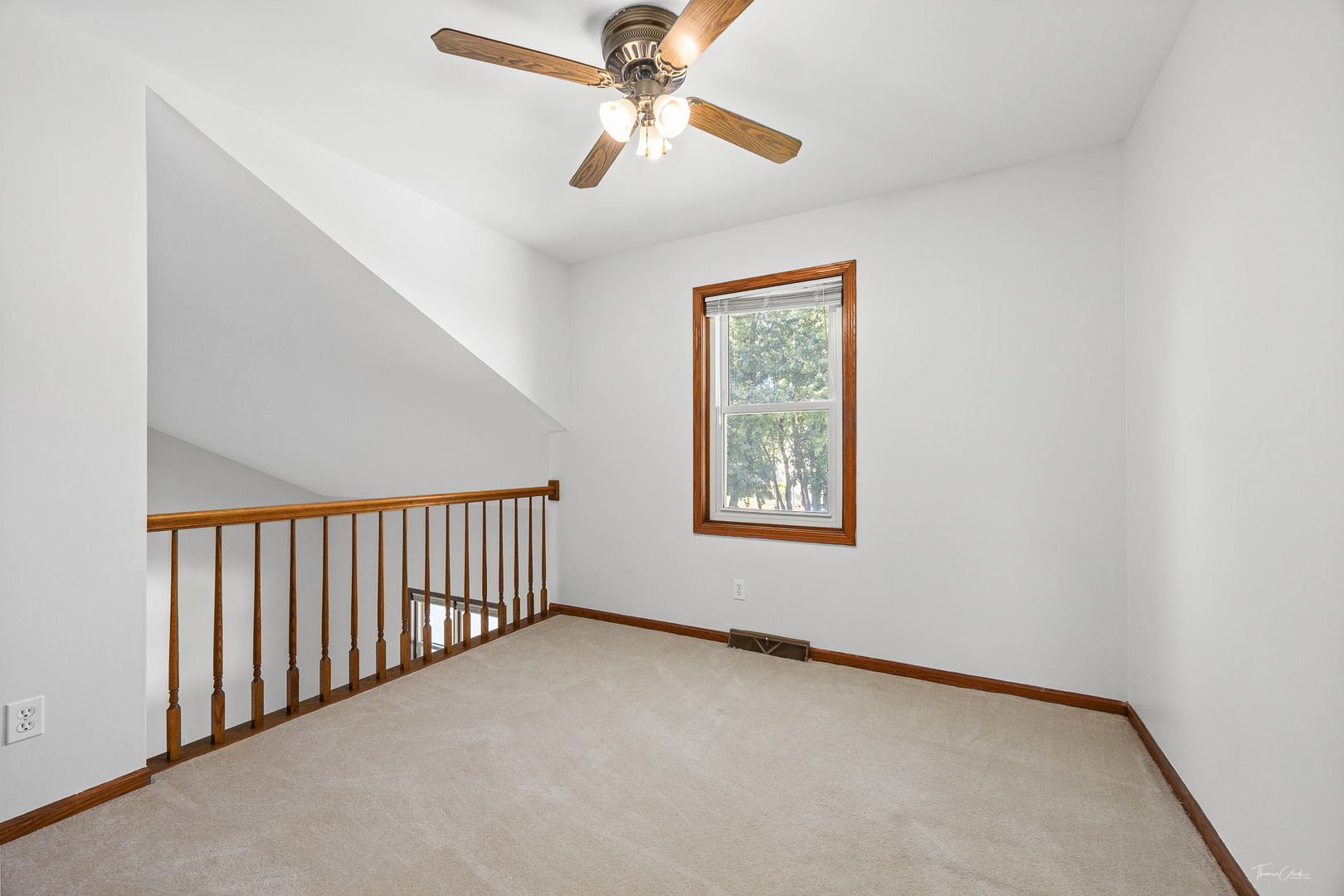 703 Avondale Lane Aurora, IL 60504 - Photo 23 of 40 a view of a livingroom with a ceiling fan and window