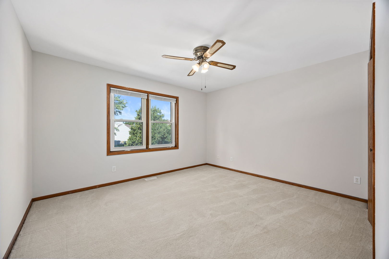 703 Avondale Lane Aurora, IL 60504 - Photo 25 of 40 an empty room with windows and fan