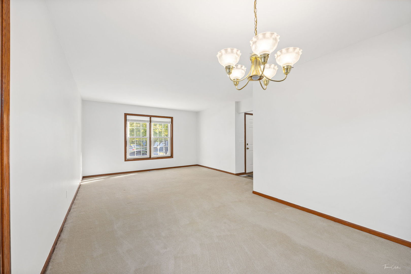 703 Avondale Lane Aurora, IL 60504 - Photo 3 of 40 a view of an empty room with a window