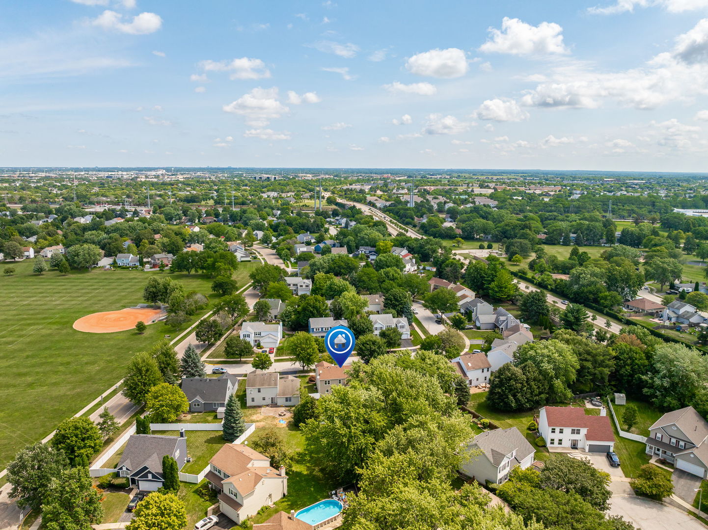 703 Avondale Lane Aurora, IL 60504 - Photo 35 of 40 an aerial view of residential houses with outdoor space and swimming pool