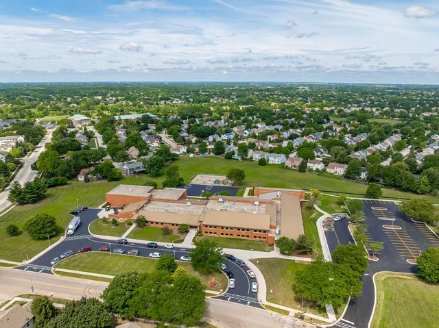 an aerial view of a house with a garden