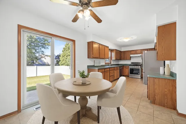 a view of a dining room with furniture window and outside view