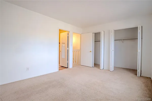 a view of an empty room with stairs