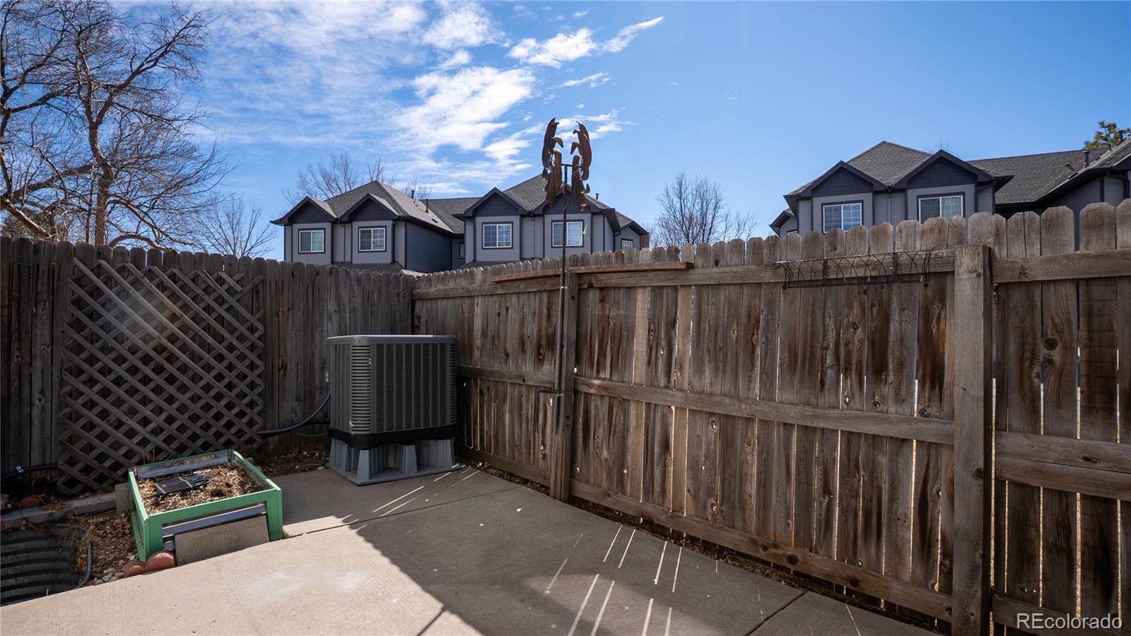 6315 Oak Street, Unit 2 Arvada, CO 80004 - Photo 27 of 34 a view of a house with wooden fence
