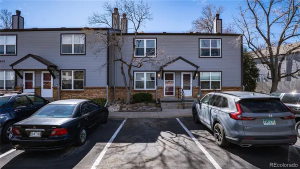 a picture of a bench in front of a wall