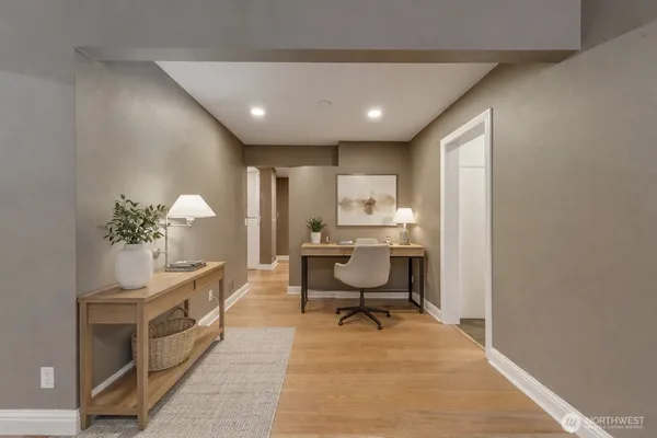 an empty room with entrance and mirror