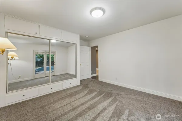 a view of an empty room with windows