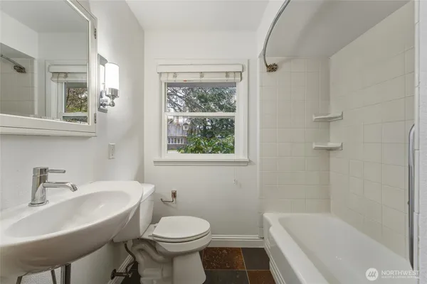 a view of a hallway with closet and a livingroom view