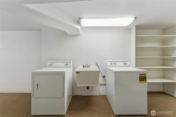 a view of a livingroom with an empty space and a window