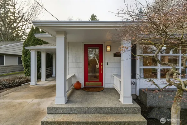 a living room with fireplace furniture and a wooden floor