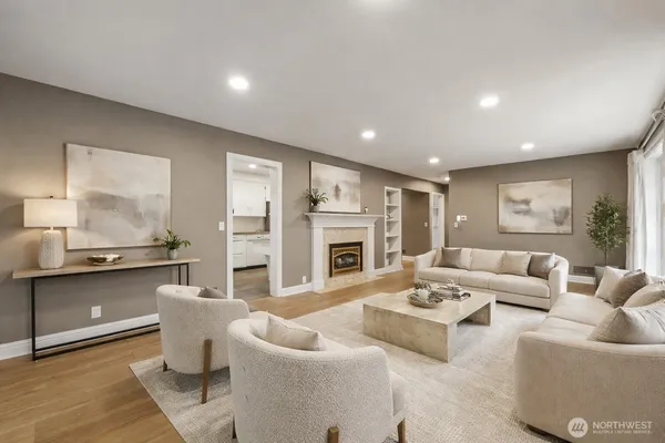 a view of an empty room with a fireplace