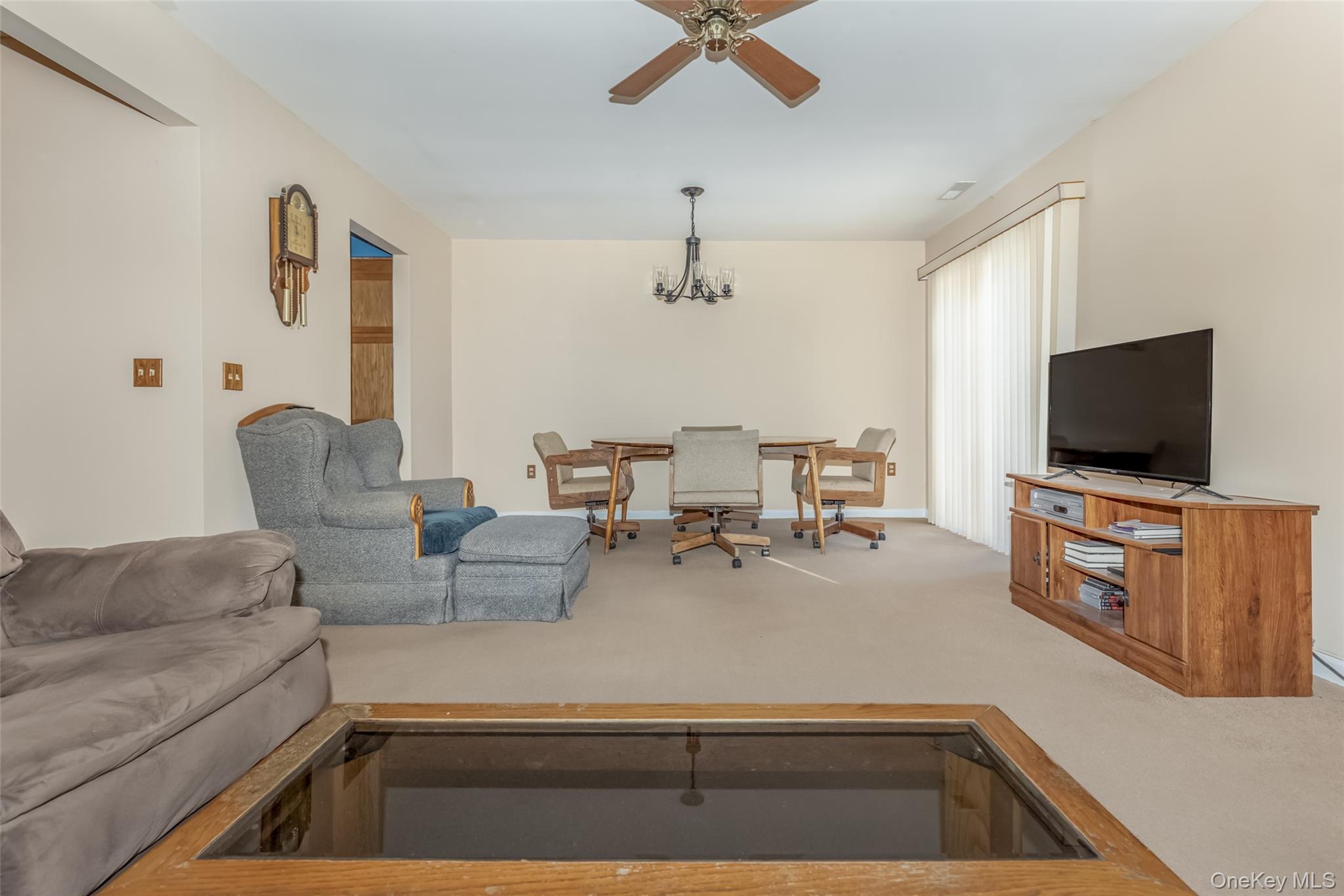 57 Winding Brook Drive Walden, NY 12586 - Photo 15 of 33 a living room with furniture and a flat screen tv