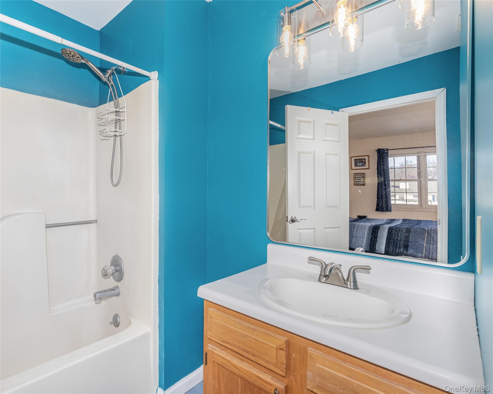 57 Winding Brook Drive Walden, NY 12586 - Photo 25 of 33 a bathroom with a granite countertop sink mirror and a bathtub