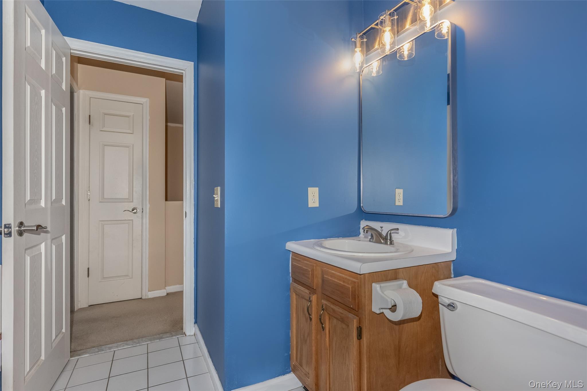 57 Winding Brook Drive Walden, NY 12586 - Photo 31 of 33 a bathroom with a sink toilet and mirror