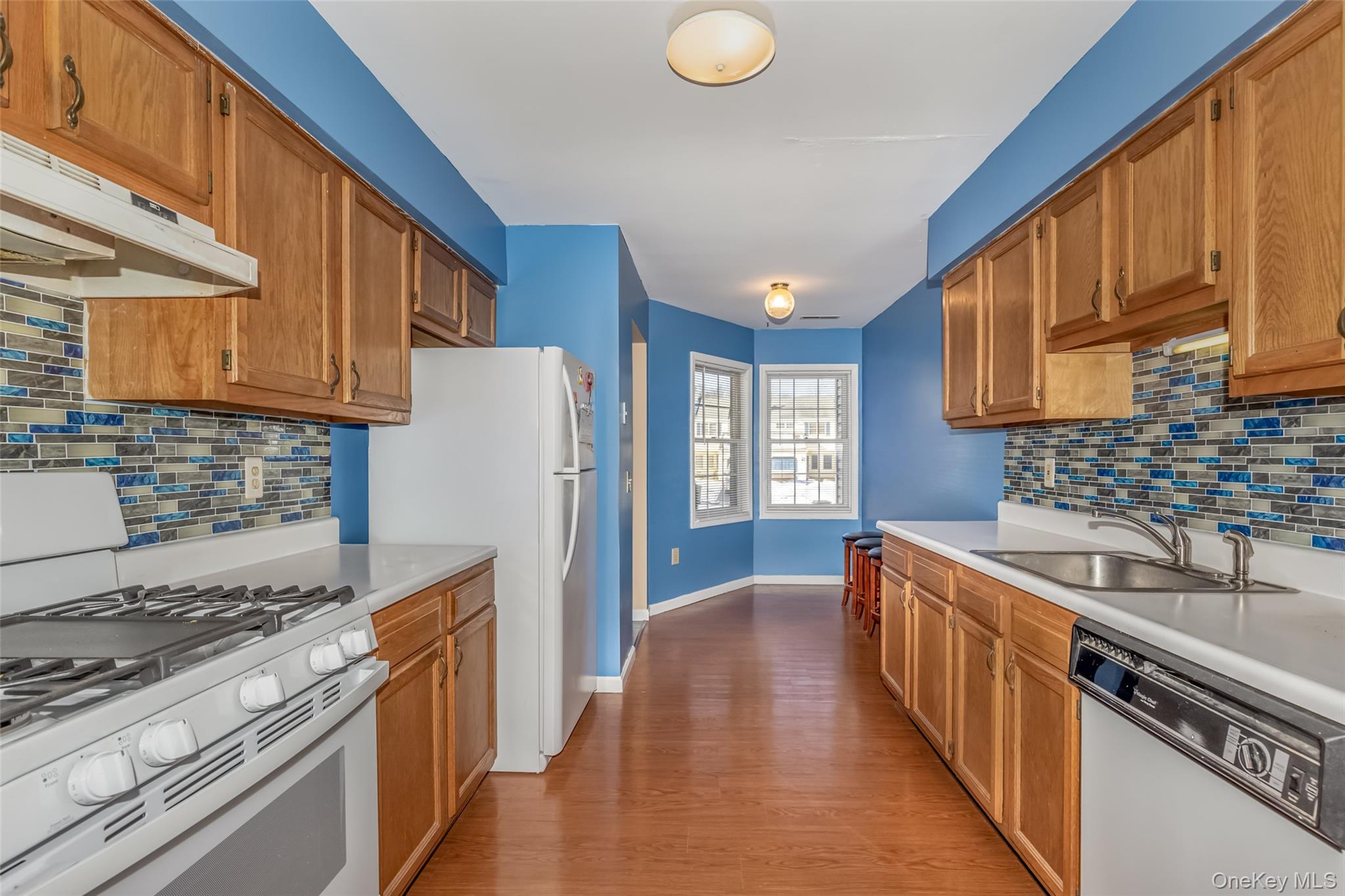 57 Winding Brook Drive Walden, NY 12586 - Photo 7 of 33 a kitchen with stainless steel appliances granite countertop a stove a sink dishwasher and a refrigerator