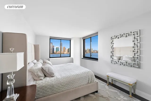 a bedroom with a bed and a couch