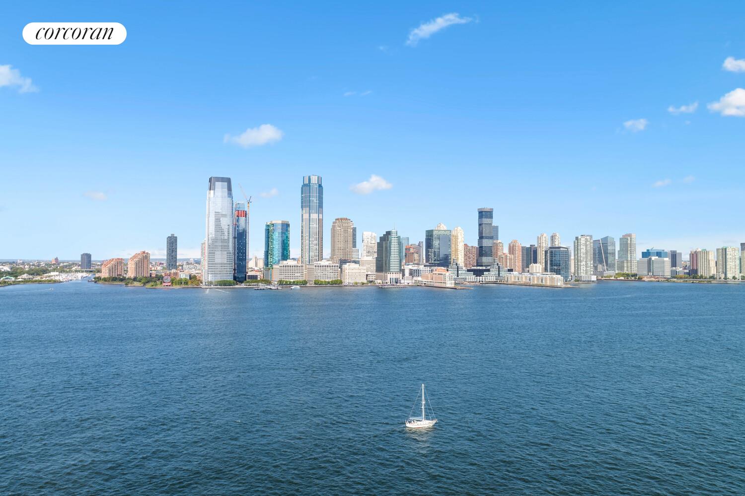 377 Rector Place, Unit 20B Manhattan, NY 10280 - Photo 9 of 10 a view of a city with tall buildings in the background