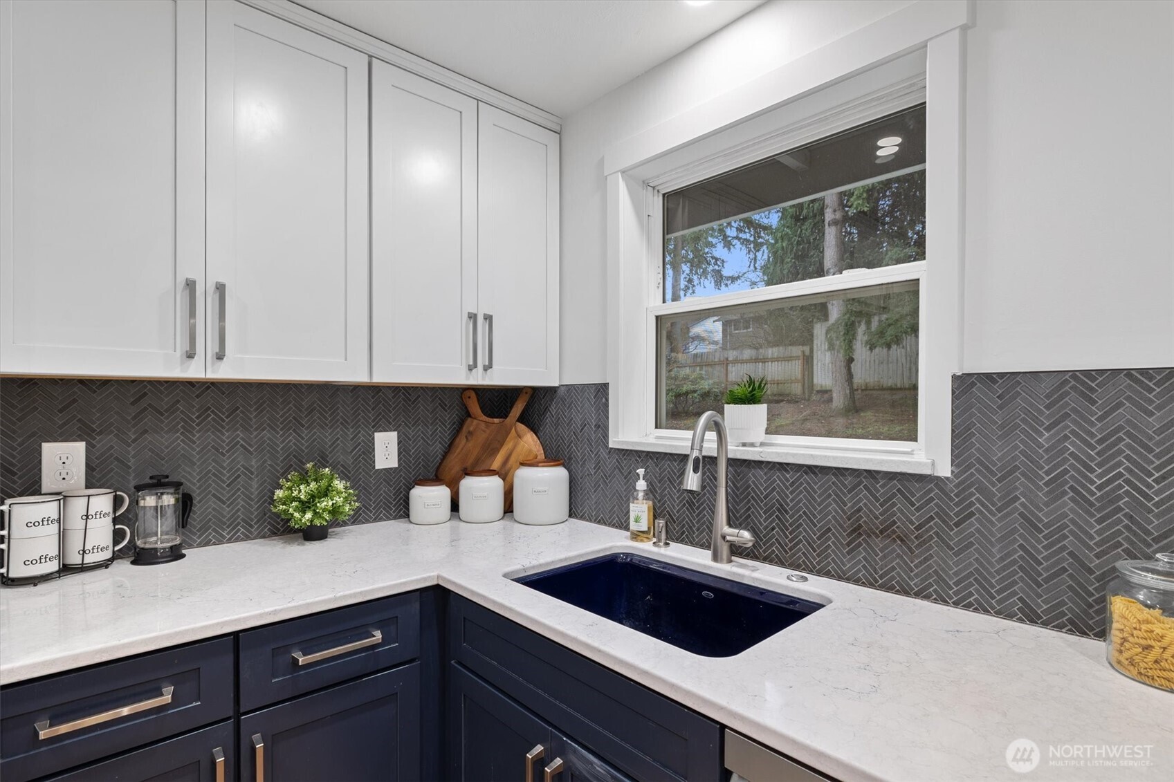 9218 Northeast 184th Place Bothell, WA 98011 - Photo 11 of 37 a kitchen with a sink and cabinets