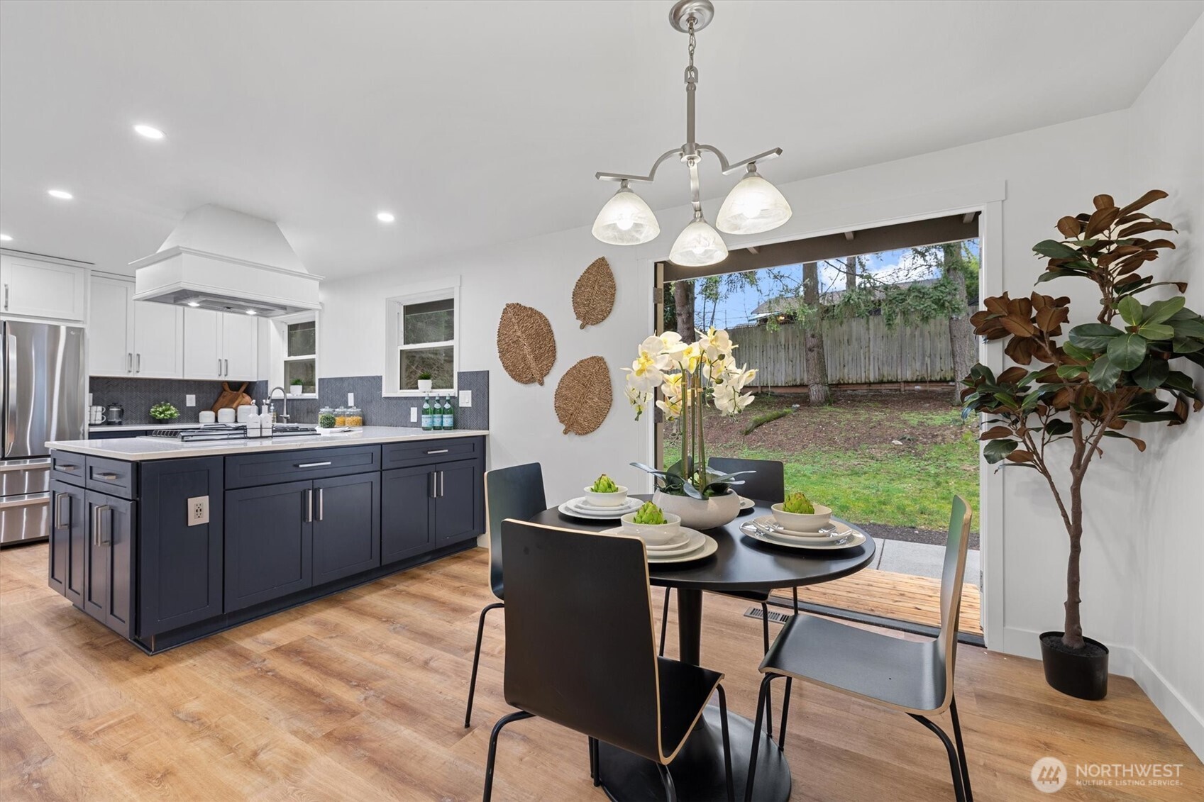9218 Northeast 184th Place Bothell, WA 98011 - Photo 14 of 37 a kitchen with a table and chairs in it