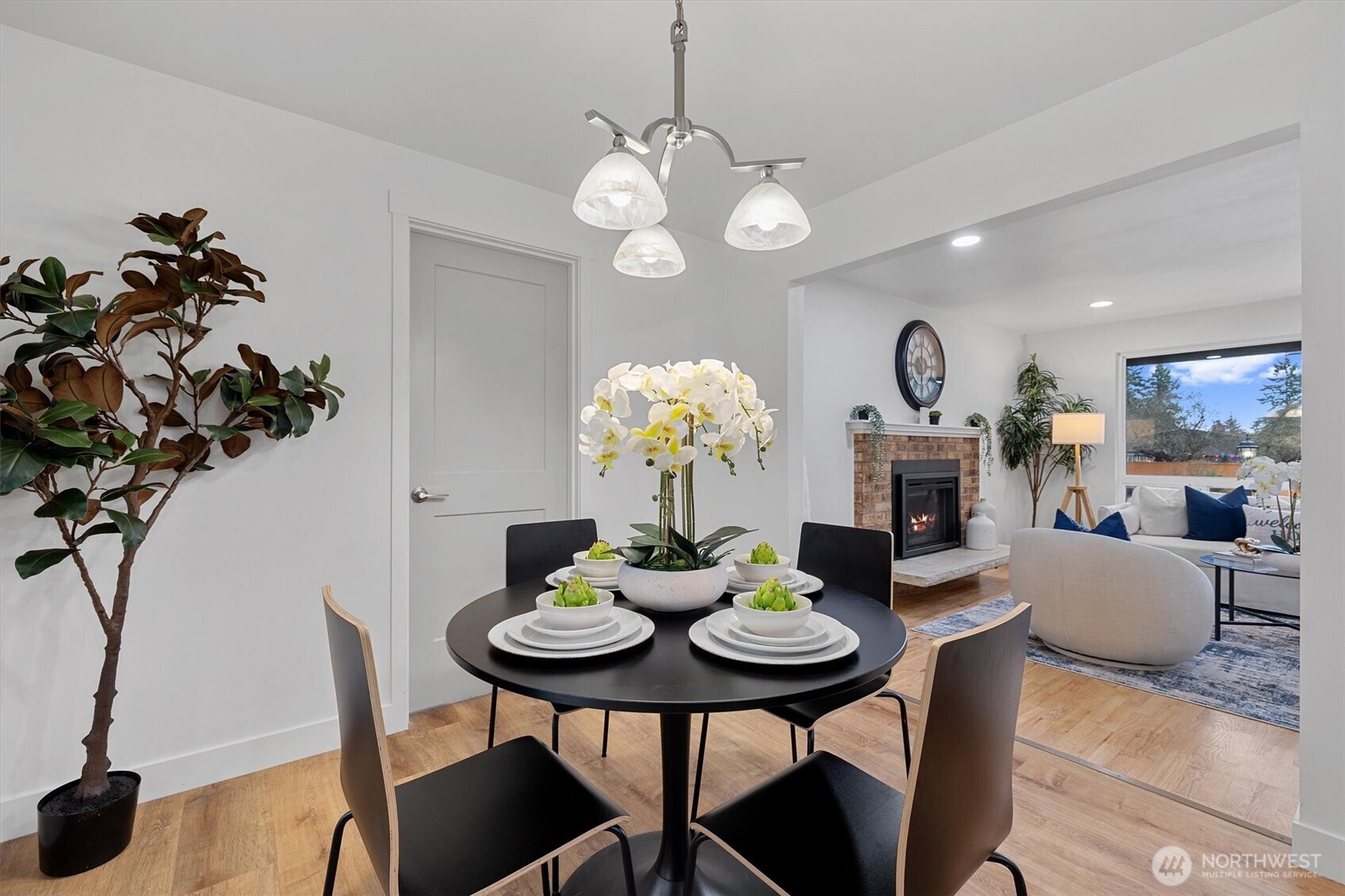 9218 Northeast 184th Place Bothell, WA 98011 - Photo 16 of 37 a view of a dining room with furniture and wooden floor