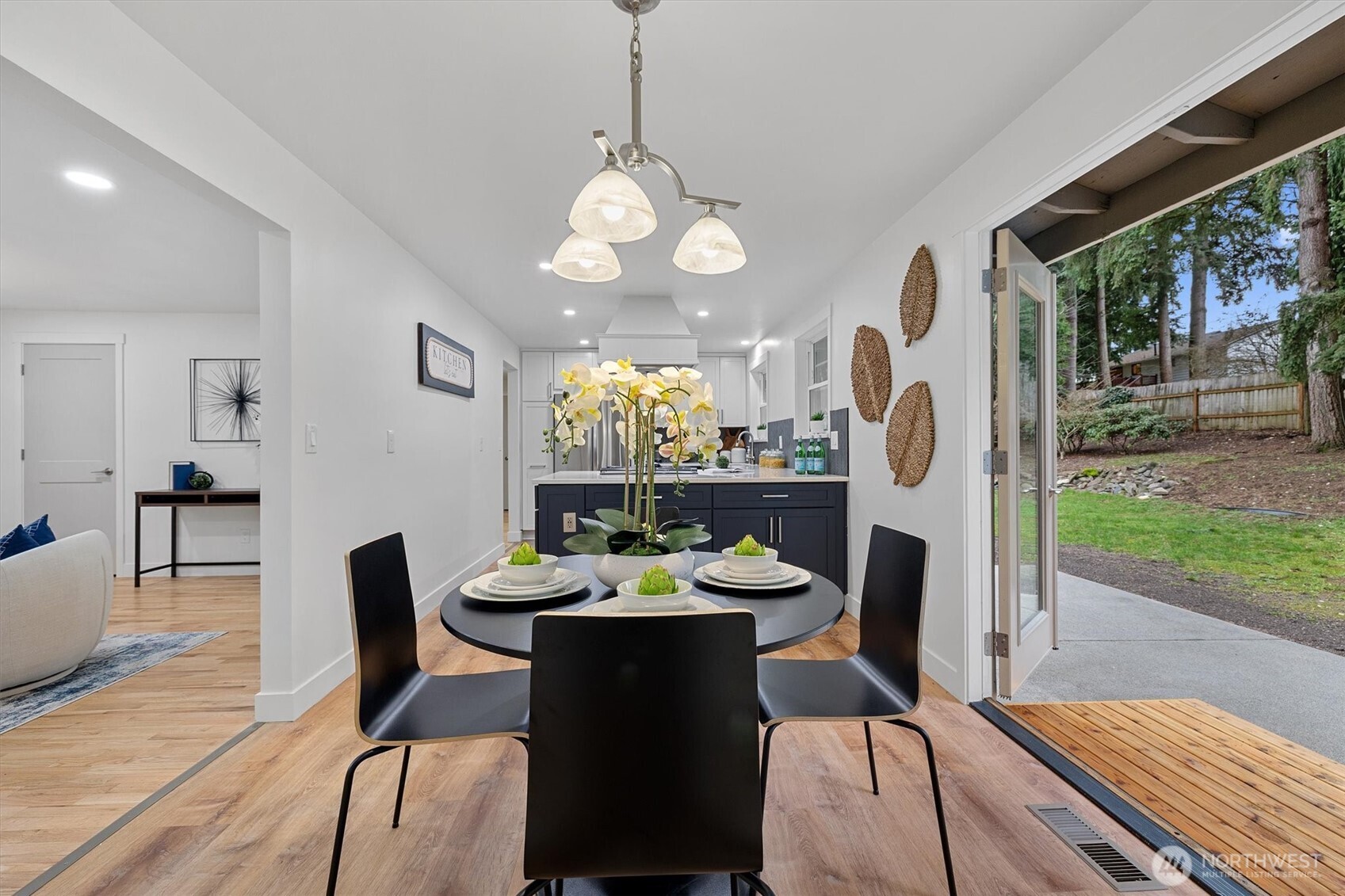 9218 Northeast 184th Place Bothell, WA 98011 - Photo 17 of 37 a view of a dining room with furniture window and wooden floor