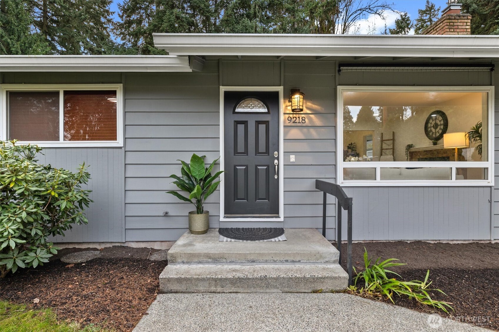 9218 Northeast 184th Place Bothell, WA 98011 - Photo 2 of 37 a front view of a house with a porch
