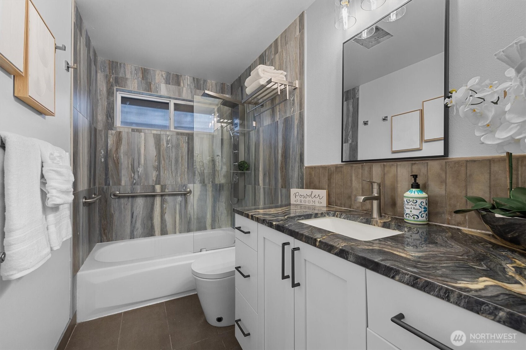 9218 Northeast 184th Place Bothell, WA 98011 - Photo 22 of 37 a bathroom with a granite countertop sink a toilet and bathtub