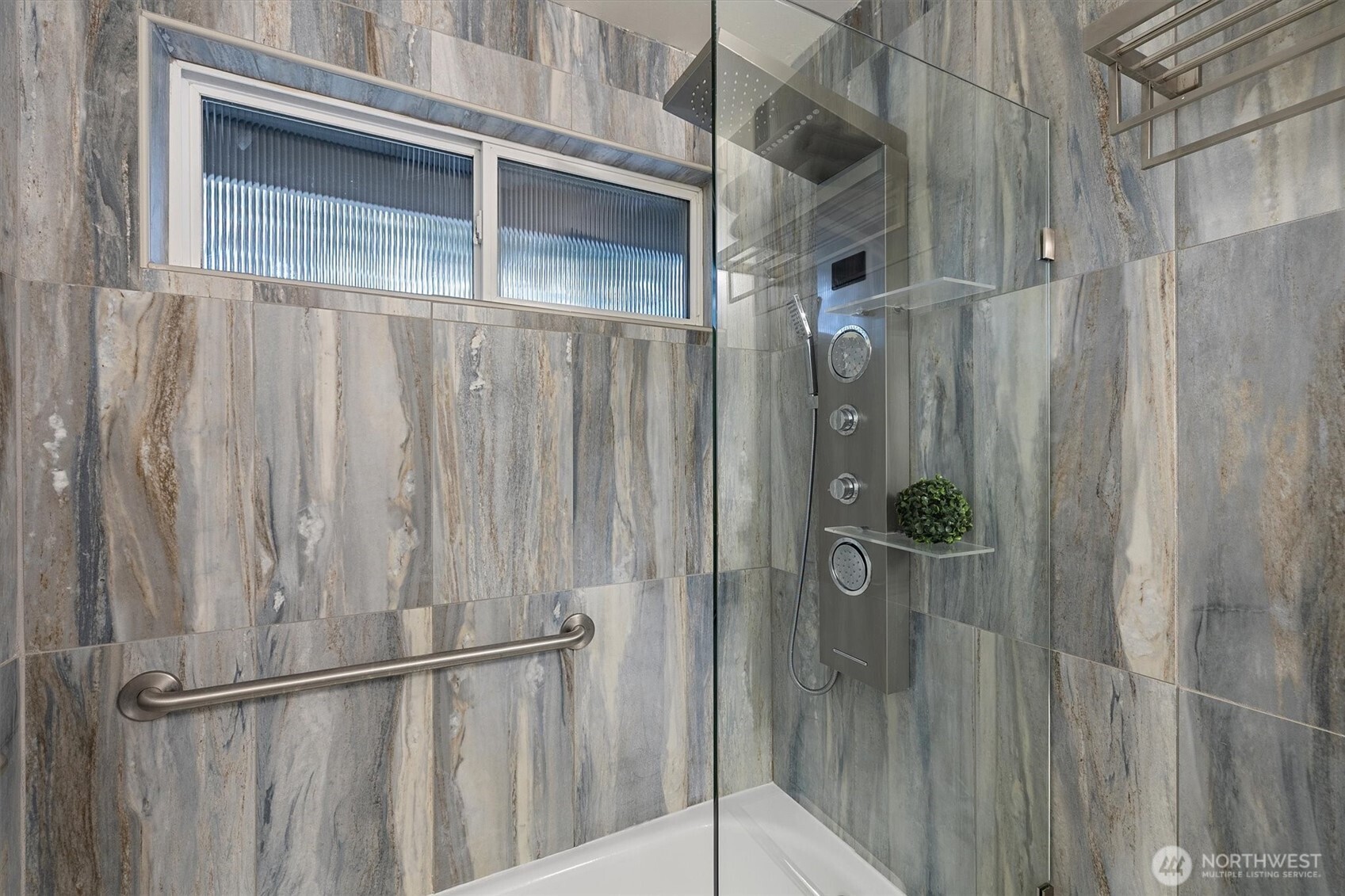 9218 Northeast 184th Place Bothell, WA 98011 - Photo 23 of 37 a bathroom with a glass shower door