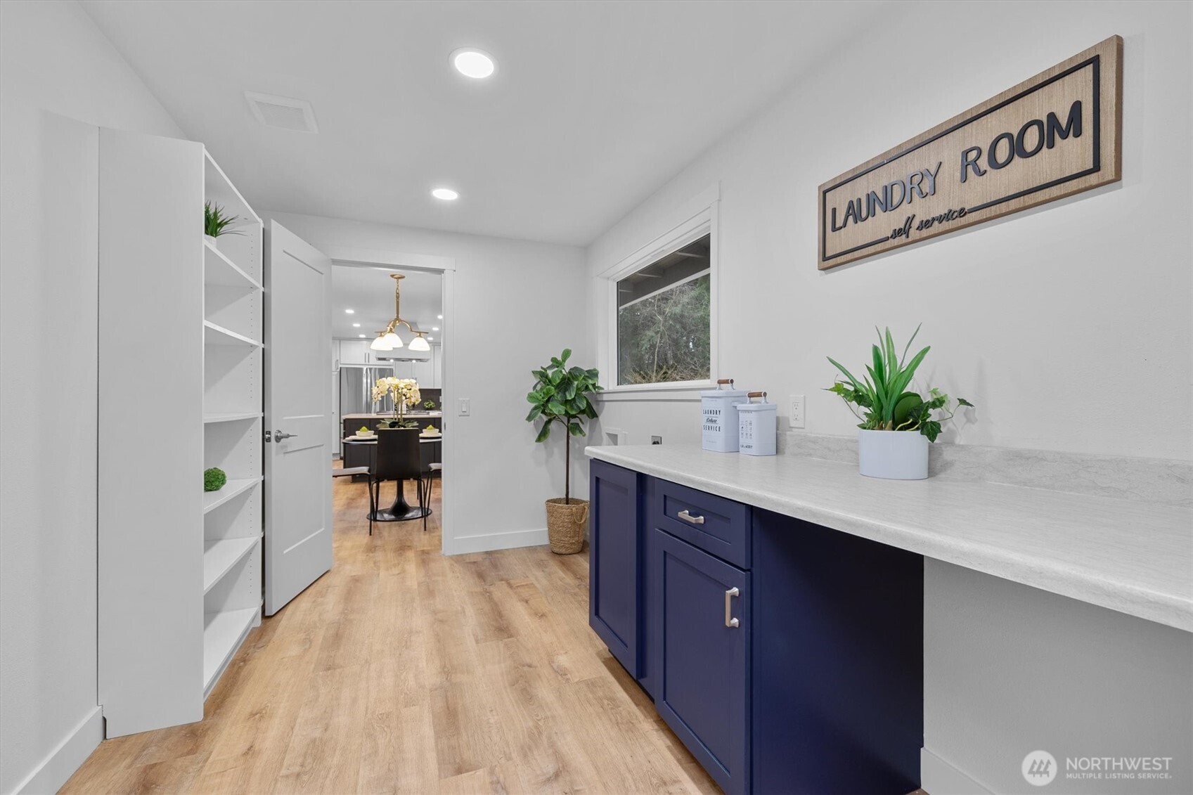 9218 Northeast 184th Place Bothell, WA 98011 - Photo 25 of 37 a kitchen with kitchen island a counter top space and a potted plant