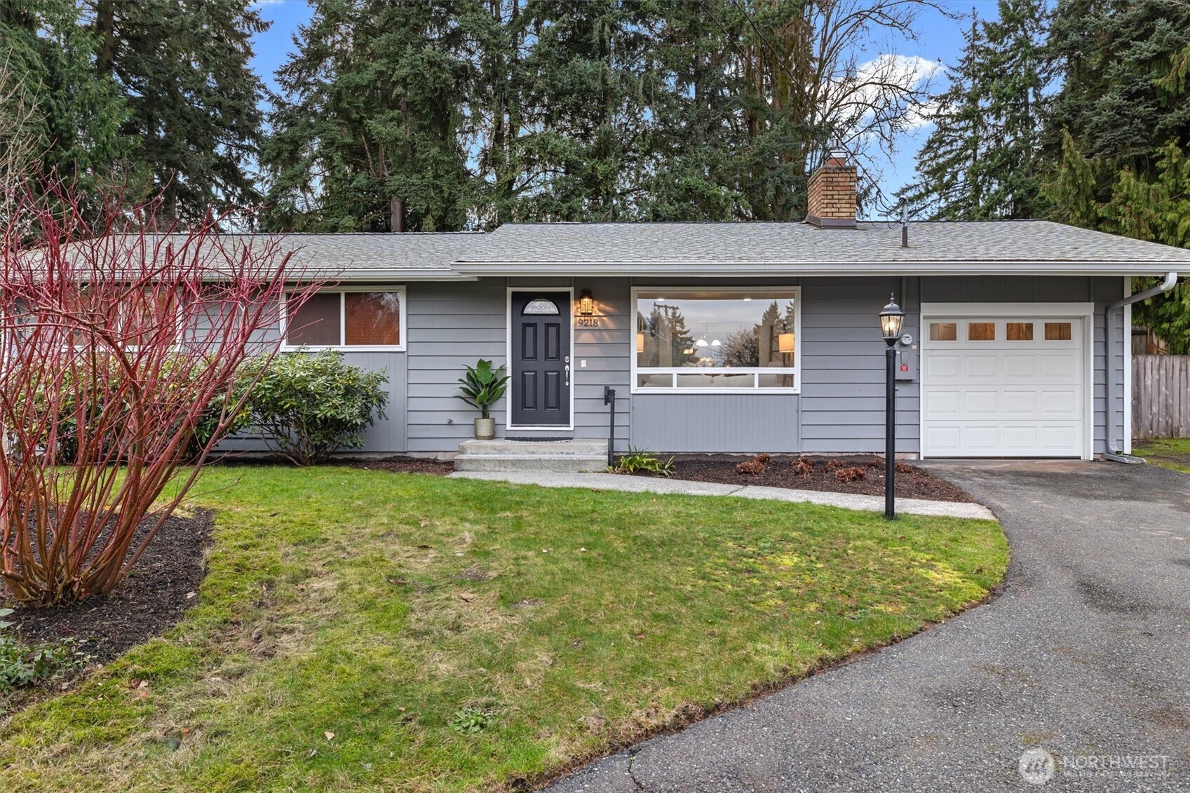 9218 Northeast 184th Place Bothell, WA 98011 - Photo 27 of 37 a front view of a house with garden