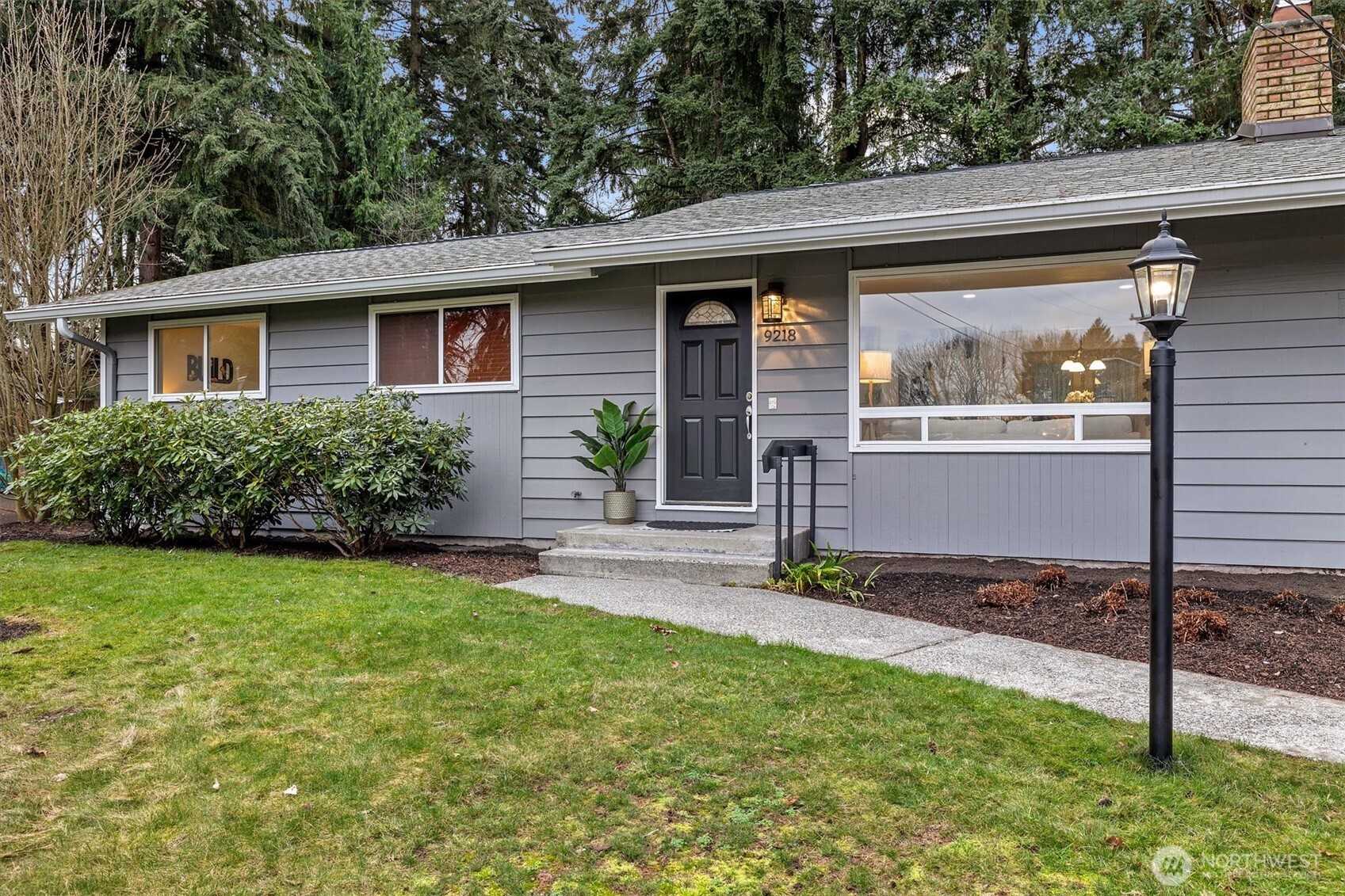 9218 Northeast 184th Place Bothell, WA 98011 - Photo 28 of 37 a front view of a house with garden