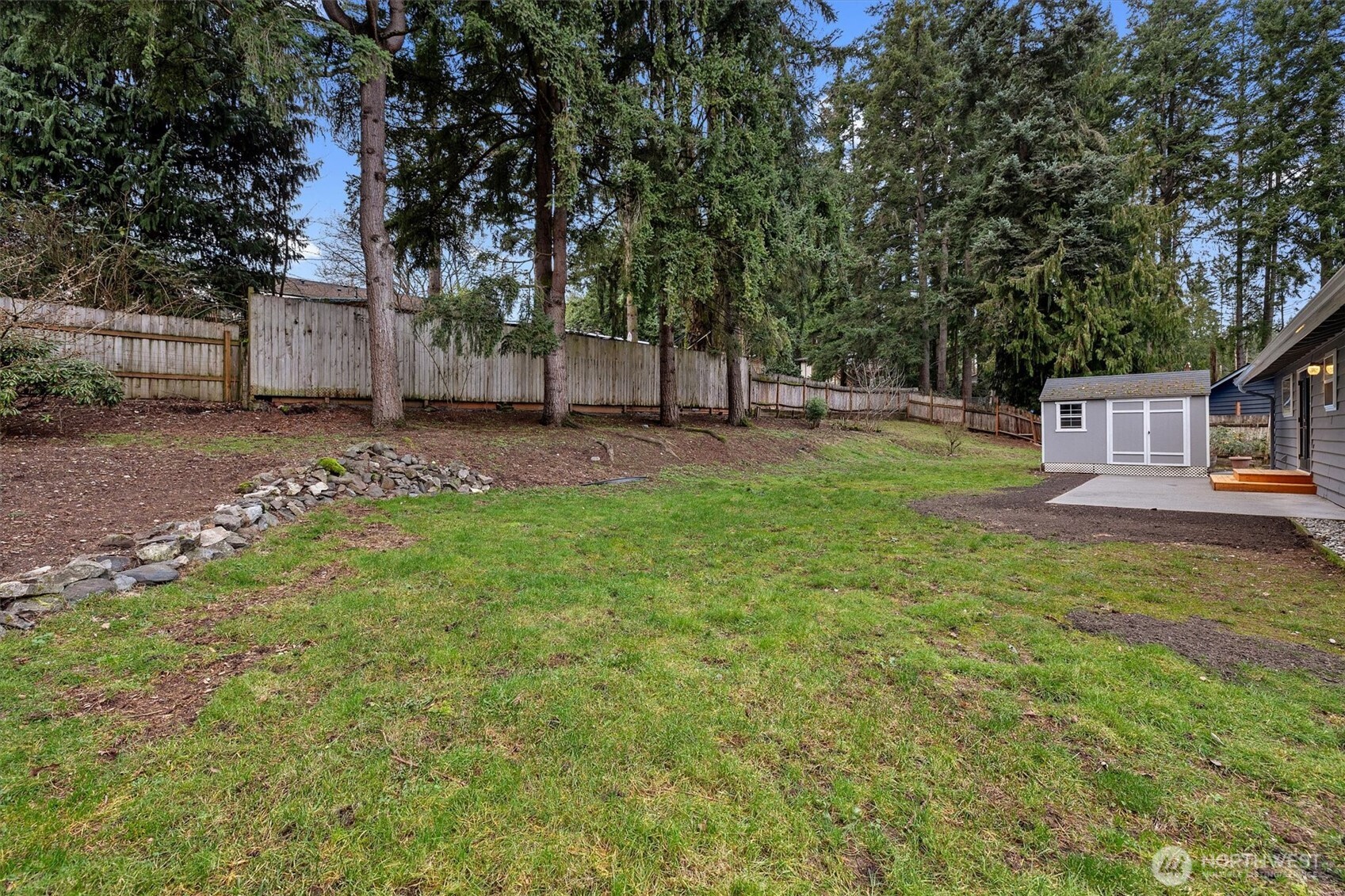 9218 Northeast 184th Place Bothell, WA 98011 - Photo 29 of 37 a backyard of a house with table and chairs