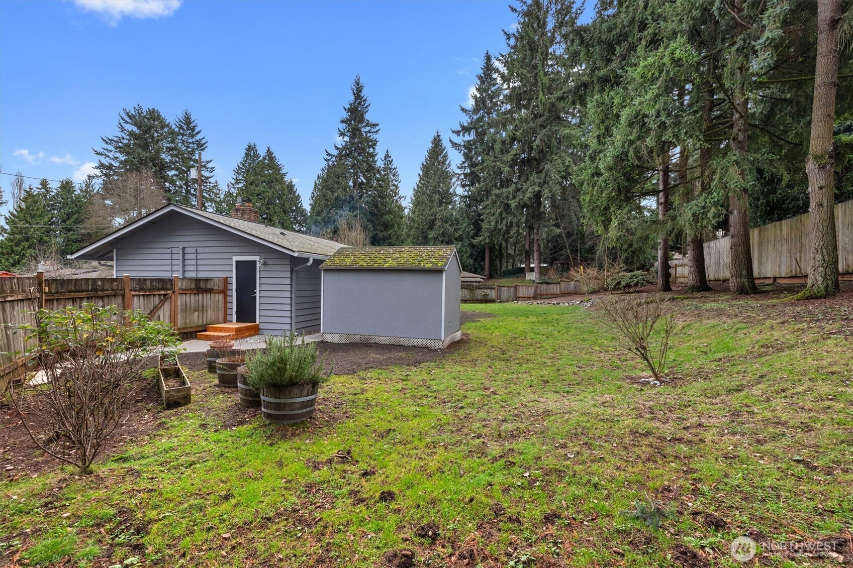9218 Northeast 184th Place Bothell, WA 98011 - Photo 30 of 37 a backyard of a house with table and chairs